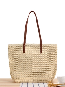 Minimalist beige woven tote bag with brown leather handles for summer beach vacations