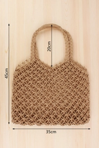 Detail view of woven paper rope tote bag showing 35cm width and hollow mesh texture