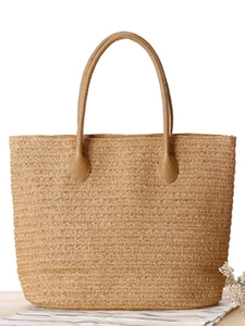 Minimalist straw woven tote bag with faux leather handles for beach and summer travel