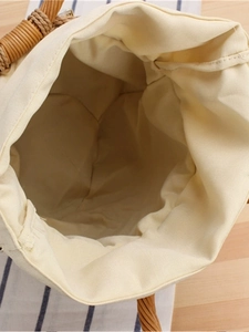 Fashionable cylinder woven tote bag with canvas lining and brown drawstring closure