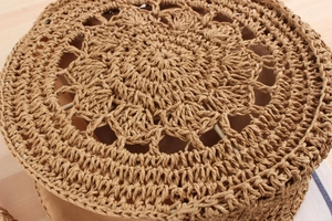 Macro shot of circular woven straw texture with intricate radial handicraft pattern