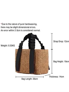 Handwoven straw tote bag with black ruffled handles and natural beige paper rope texture
