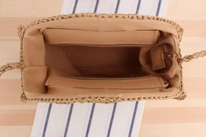 Macro shot of the woven bag interior showing zip pocket and soft cotton lining