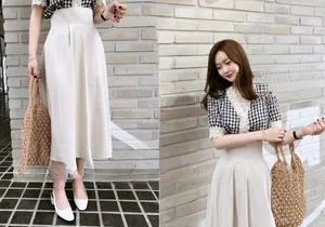 Chic summer outfit featuring a pleated skirt, plaid lace top, and straw woven handbag