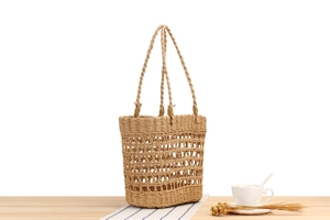 Detailed close-up of handmade woven paper rope tote bag showing hollow mesh pattern