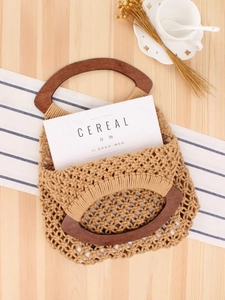 Handmade khaki cotton rope mesh tote bag with dark wooden handles for beach vacation style