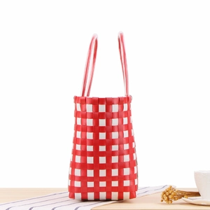 Red and white checkered woven tote bag with durable handles for beach and shopping trips