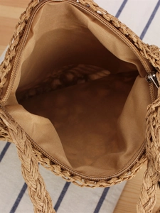 Handmade woven beach tote bag featuring a secure metal zipper and durable inner lining