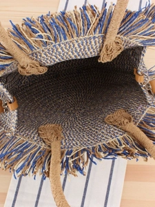 Handmade woven paper rope tote bag with blue tassels and sturdy rope handles