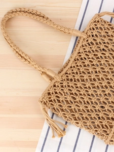 Handmade beige macrame woven shoulder bag with cotton rope mesh and fringe tassels