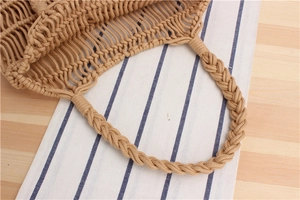 Detailed close-up of thick cotton rope handle and hand-woven mesh texture on beach tote