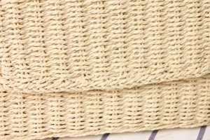 Macro detail of high-quality hand-woven paper rope bag showing natural fiber texture