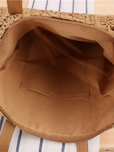 Handwoven paper rope tote bag with brown lining, internal pocket and zipper closure