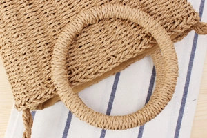 Macro shot of natural paper rope woven texture with interior lining and zipper closure