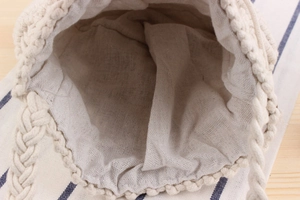 Detail view of cotton drawstring bag showing woven texture and spacious interior storage
