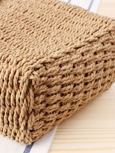 Handcrafted woven paper rope crossbody bag with natural texture for beach holidays