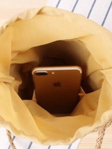 Minimalist paper rope woven bucket bag with spacious interior for large smartphones