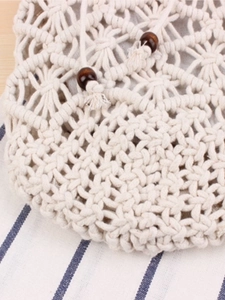 Handmade bohemian ivory cotton woven crossbody bag with wooden beads and drawstring closure