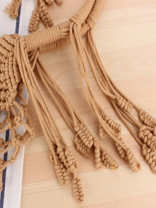 Bohemian handmade woven cotton shoulder bag with intricate tassels and fringes