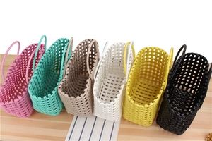 Detailed view of handmade woven PVC tote bags in six vibrant colors for summer beach use