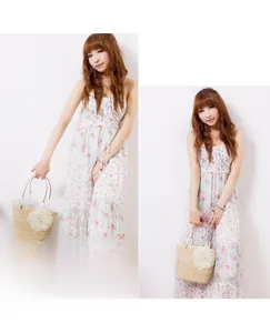 Detail of woven straw handbag featuring large lace floral accent and summer floral tiered dress