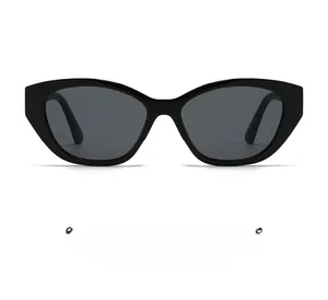 Front view of black cat-eye sunglasses with dark grey lenses on white background