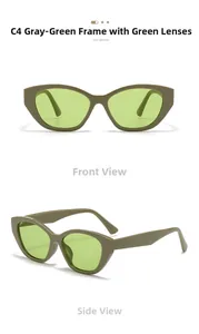 Detail view of cat eye sunglasses with grey-green frames and light green tinted lenses