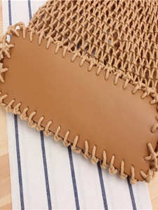 Handmade woven mesh tote bag with smooth brown leather base and khaki crochet details