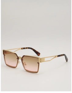 Detail of square gold metal sunglasses featuring hollow temples and gradient lenses