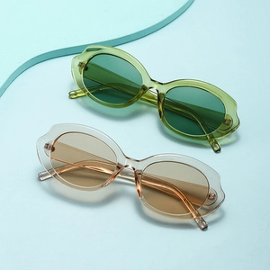 Lunettes de soleil ovales rétro avec montures ondulées transparentes vertes et brunes