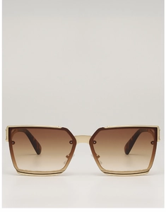 Front view of square oversized sunglasses with gold metal frame and brown gradient lenses