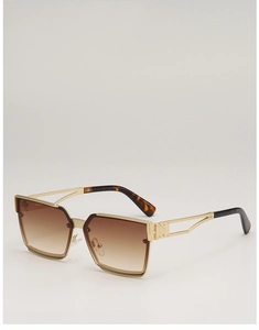 Detail of square gold sunglasses featuring hollow metal temples and tortoiseshell tips