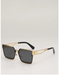 Detail of gold metal hollow temples and black tips on square fashion sunglasses
