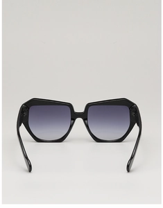 Detail of thick black square sunglasses frame with grey gradient lenses for UV protection