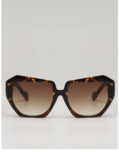 Detail of square oversized sunglasses with brown tortoiseshell frame and gradient lenses