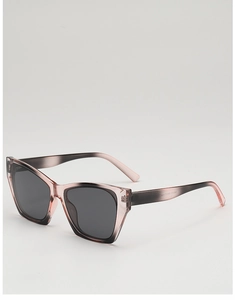 Detail of trendy cat-eye sunglasses with gradient grey-pink frame and internal specs