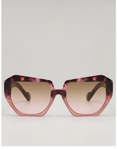 Detail of thick acetate frames with unique tortoiseshell texture and gradient lenses