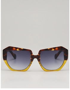 Detail of square oversized sunglasses with tortoiseshell and yellow contrast frame