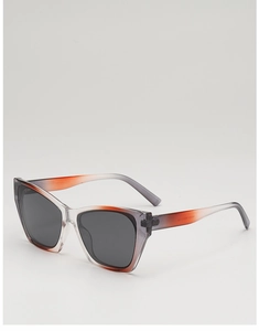 Detail view of cat eye sunglasses showing gradient acetate frames and printed model code