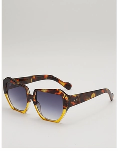 Detail of tortoise shell square sunglasses frame with metal rivets and gradient lenses