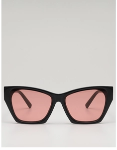 Detailed view of black cat-eye sunglasses with peach pink lenses and thick frame