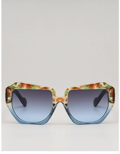 Detail of square sunglasses with orange green textures and blue gradient lenses