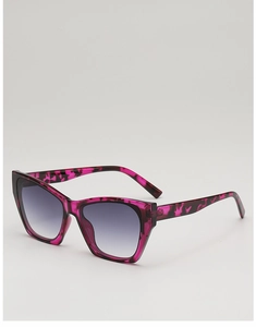 Detail of burgundy leopard cat-eye sunglasses with grey gradient lenses and wide frame