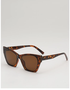 Detail of retro cat-eye sunglasses with tortoise shell frames and brown tinted lenses