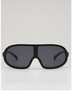 Close-up of sleek black shield sports sunglasses with seamless wrap-around frame design