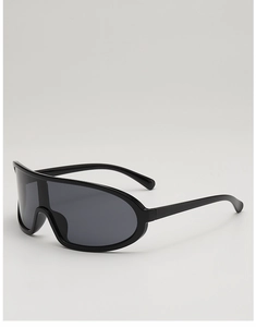 Close-up of sleek black shield sports sunglasses with seamless aerodynamic frame design