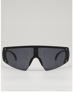 Close-up of matte black shield sunglasses with silver rivets and grey lenses