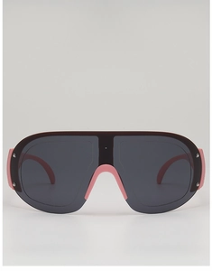 Detail view of large rimless sports sunglasses with dark lenses and pink bridge accents