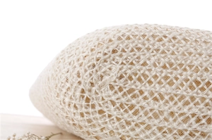 Close-up of natural beige hand-woven straw bag texture with rustic mesh rope craft
