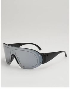 Detail of mirrored silver lenses and black wide temples on sporty oversized sunglasses